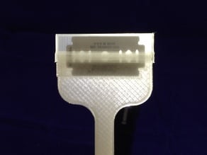 razor blade scraper with cover and retention tabs