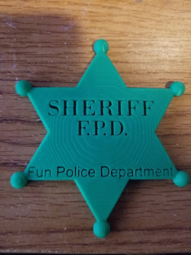 Sheriff Badge that says fun police.