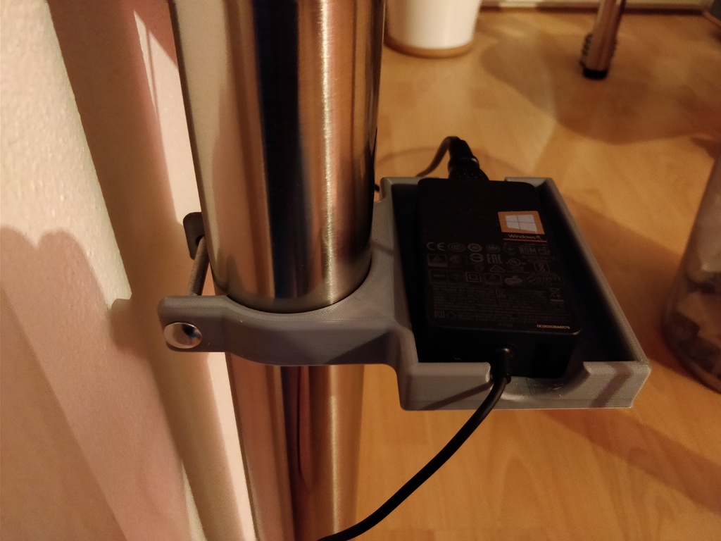 Table leg clamping holder for power adapters
