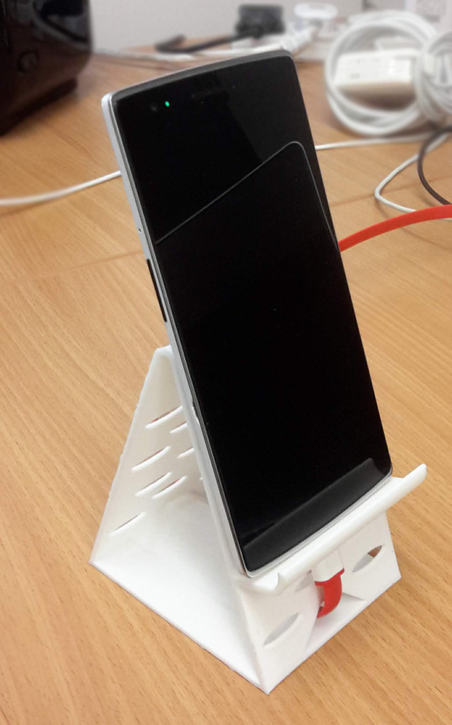 Phone stand with a cable tunnel