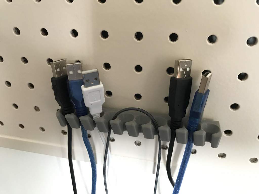 USB cable holder for pegboard