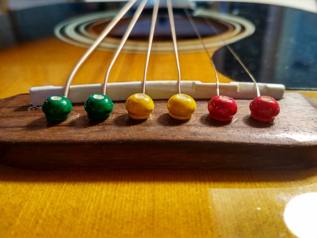 Guitar bridge pins and saddle
