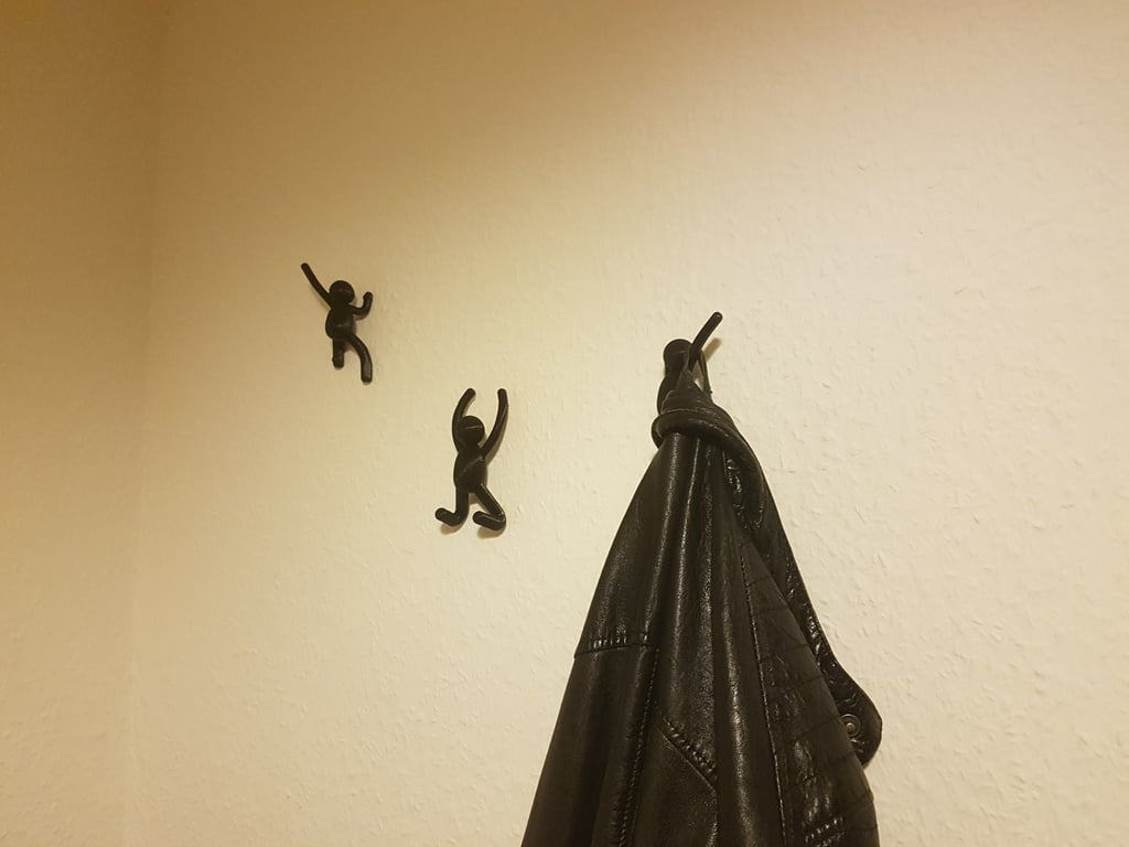 Climbing man wall hangers