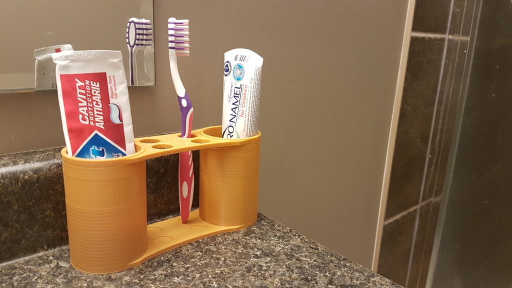 Dual cup toothbrush holder