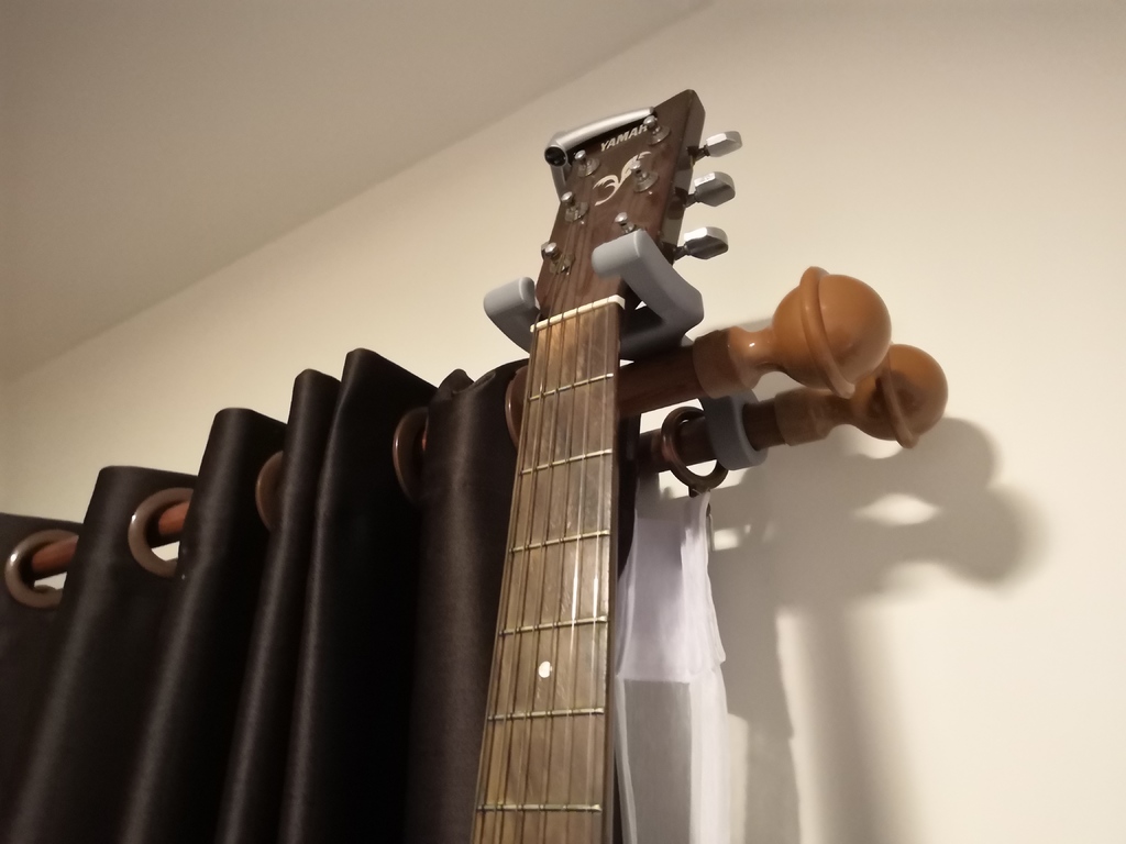 Guitar hanger for curtain rails