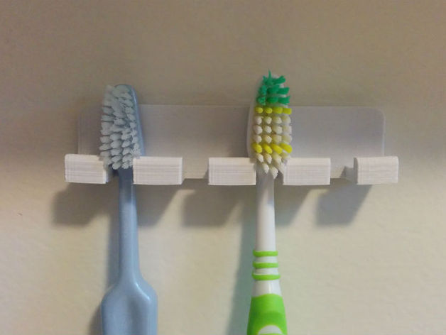 Wall-mounted toothbrush holder with rounded corners