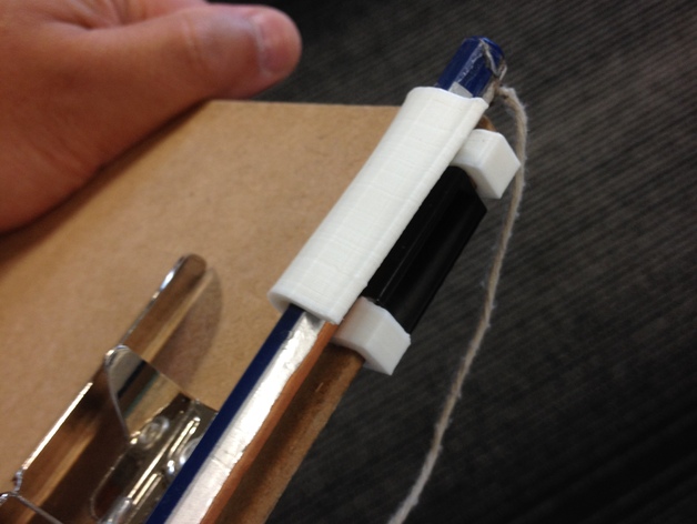 Clipboard pen holder, secured by a binder clip