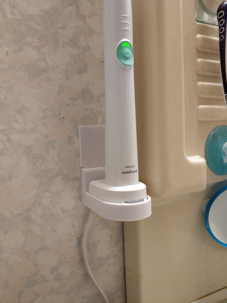 Staple-able sonicare charger wall mounter v1