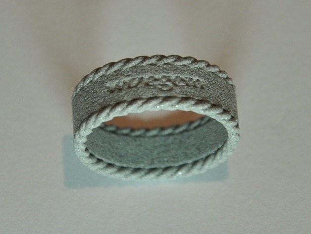 ring with text and rope decoration