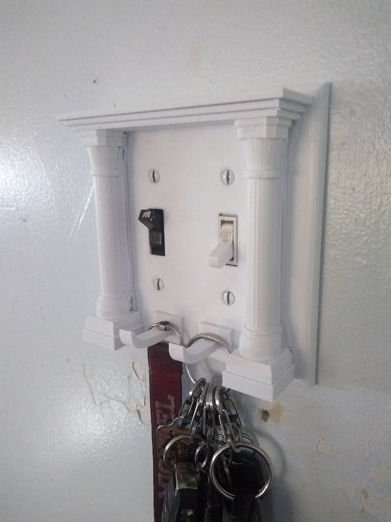 Fancy dual light switch cover / key holder