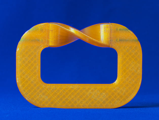 Moebius strip. Easy to print, no support needed, but 2 piece.