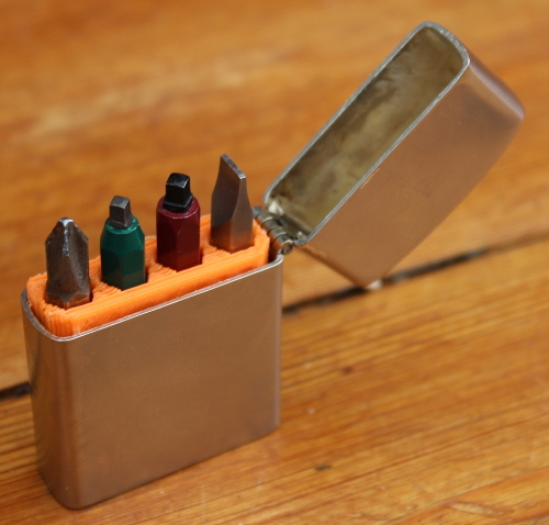 Insert for holding screwdriver bits in a lighter