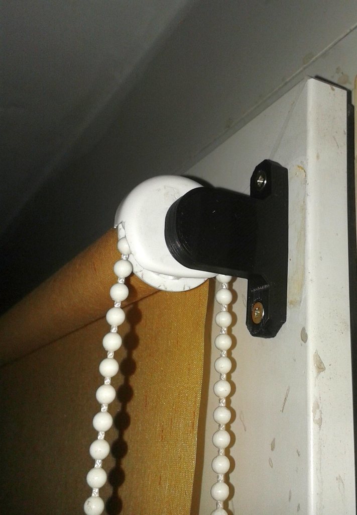 Blinds holder mounted on window by screws.