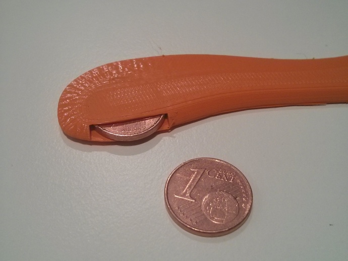 Coin-weighted tri-bladed boomerang