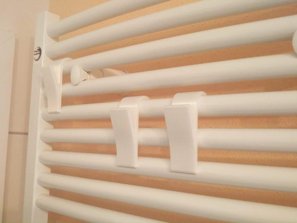 Towel hanger for the bathroom heater