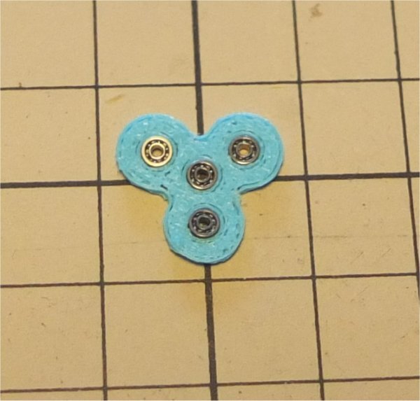 Spinner with miniature bearings