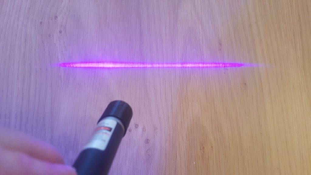 Laser pen lens tip