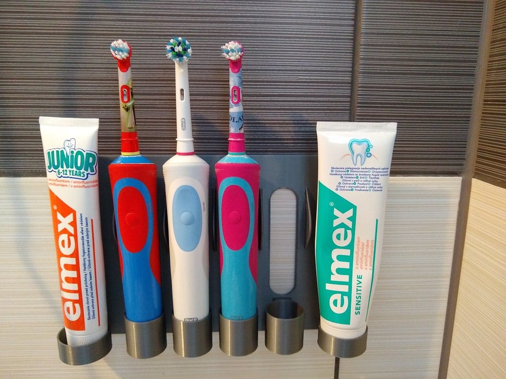 Family wall mount holder electric toothbrush Oral-B and toothpaste