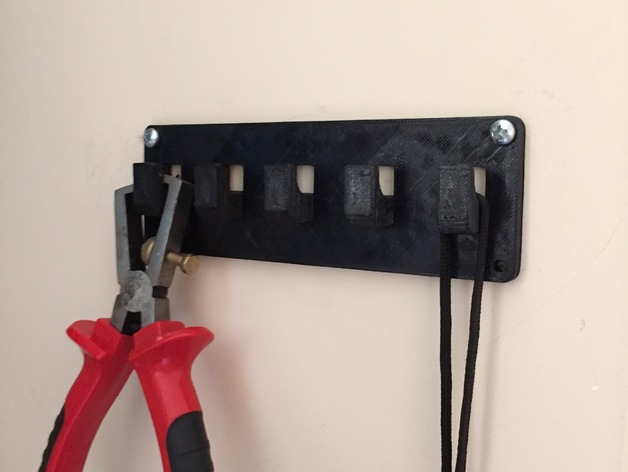 Small wall hanger for cables etc.