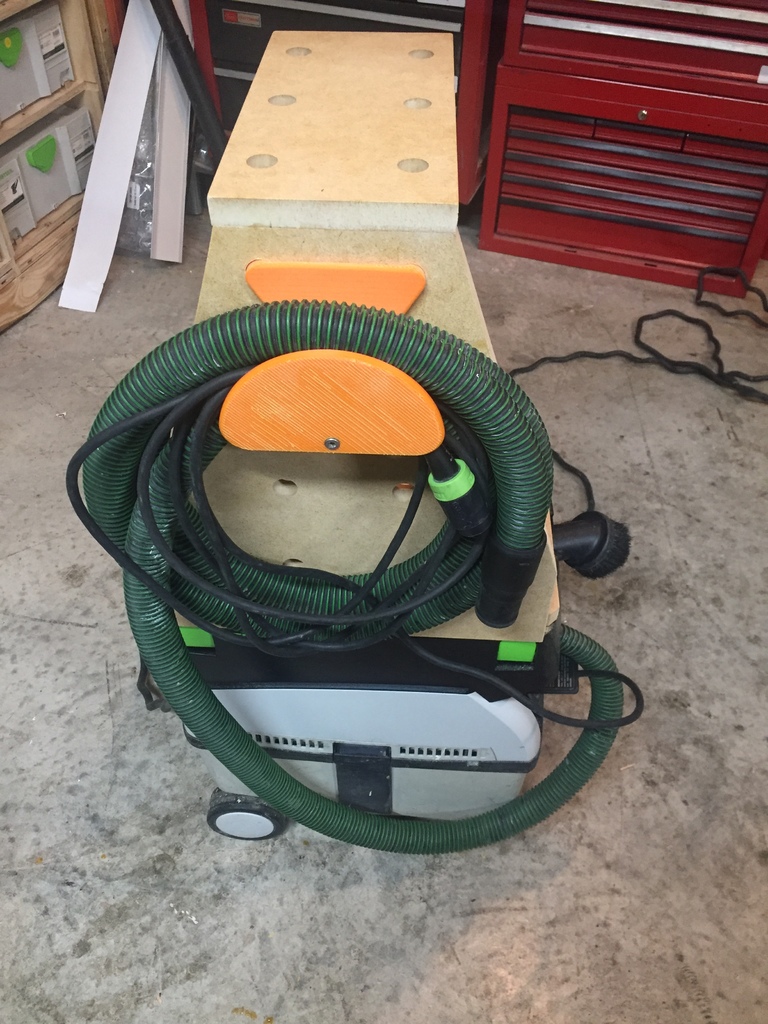 Vacuum hose holder. 