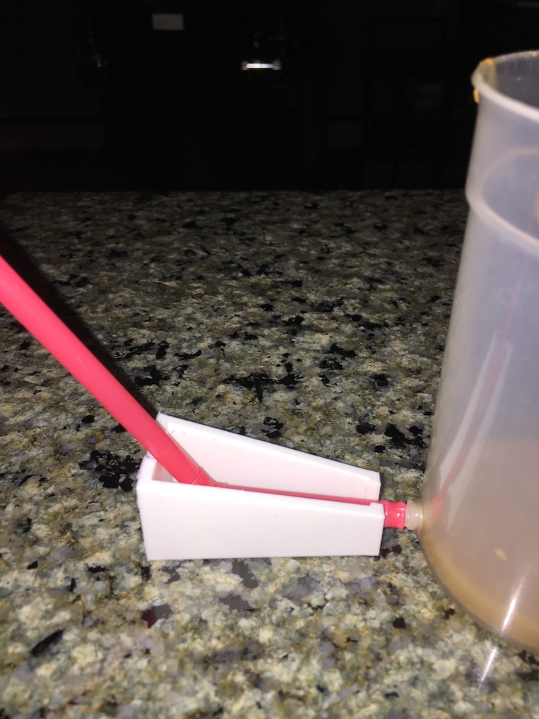 Gravity assist cup Straw holder.