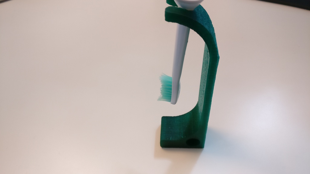 Electric toothbrush head holder