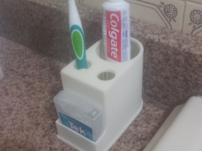 Toothbrush, toothpaste and dental floss holder