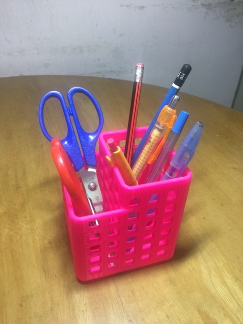 a pen holder with two compartments