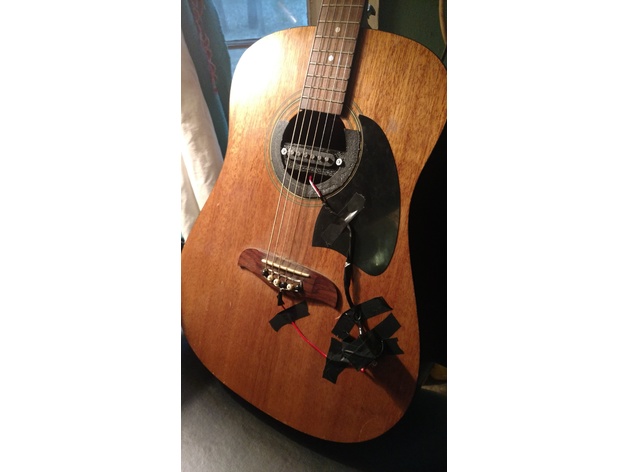 Acoustic guitar pickup cradle