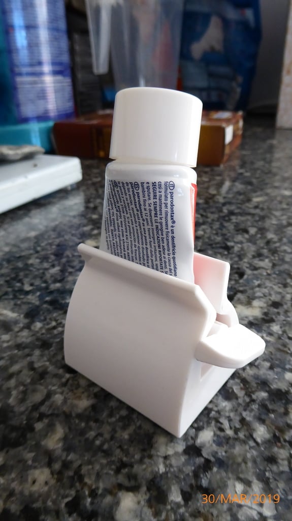 Yet another tooth paste holder and squeezer