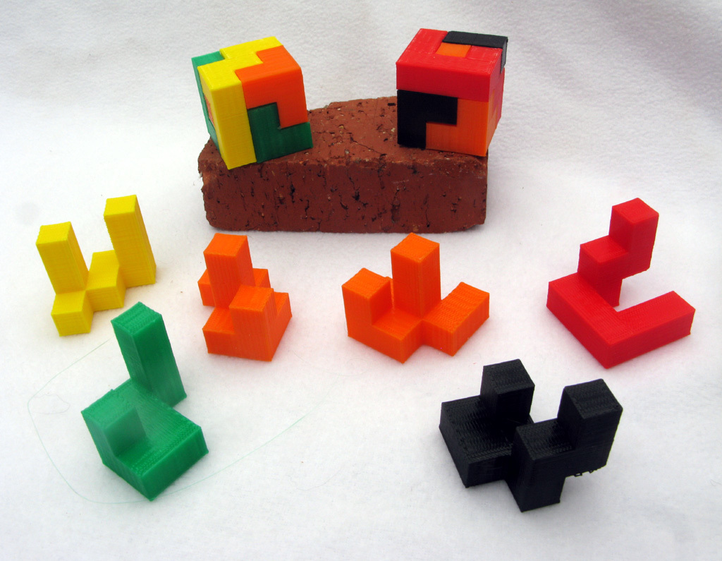 Two Simple Cube Construction Puzzles 